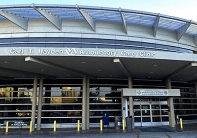 Entrance to St. Hayden VA Ambulatory Care Clinic with glass doors and protective barriers.