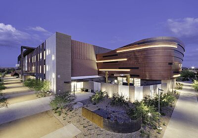 Modern building with sleek design at dusk.